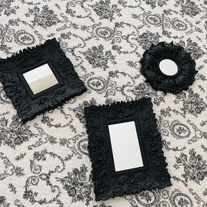 Set of 3 small decorative mirrors.